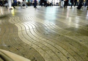 The wavy, almost watery, textured lines in the pavement evoke images of what the road used to be—a waterway from the city walls to the Mediterranean Sea